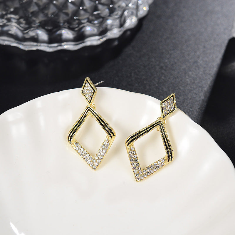 Elegant modern diamond earrings close-up view