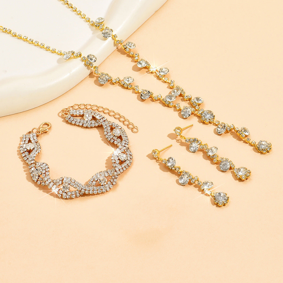 Delicate crystal pendant gold color necklace with matching earrings and claw chain for daily wear 