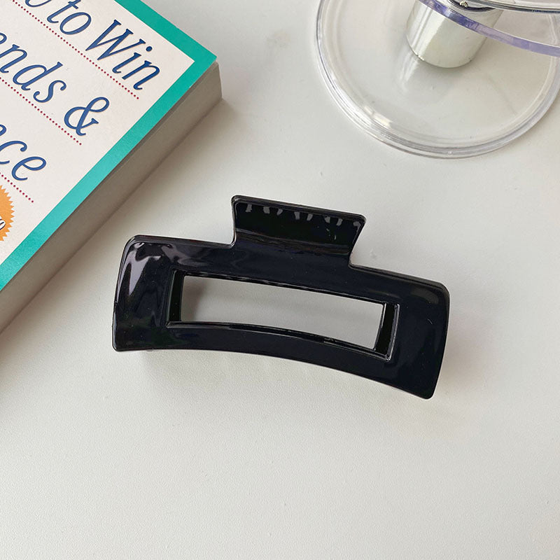 Durable acrylic hair clip suitable for daily wear and casual outfits.