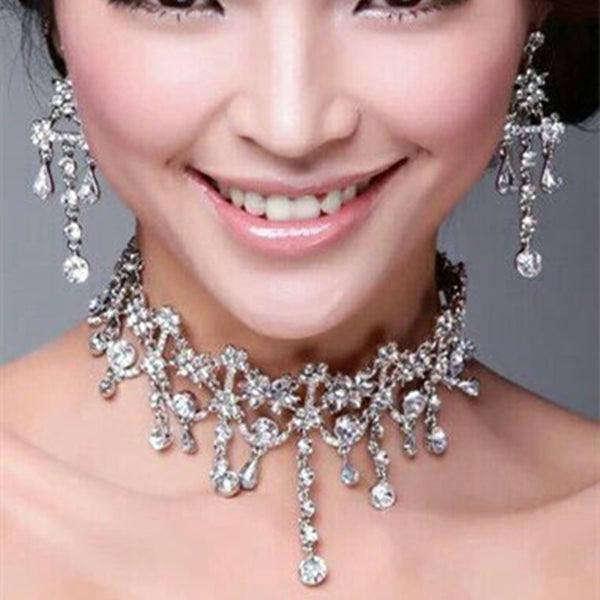 white bridal necklace and earrings set for wedding dress